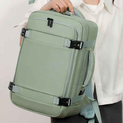 Sac à dos avion vert sauge porté à la main
